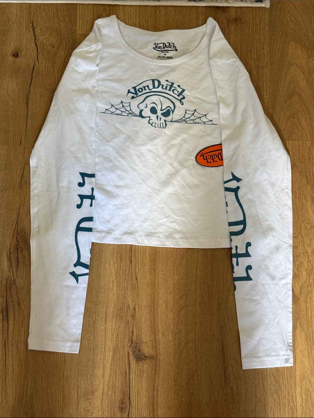 Von Dutch White Long Sleeve Crop Top with Teal Graphics and Orange Patch